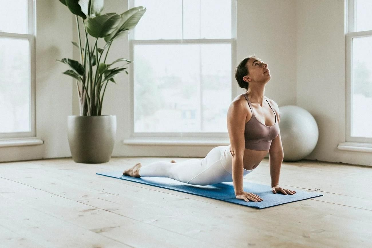 A women doing stretching in yoga room